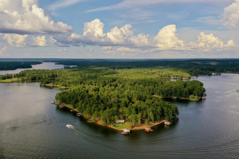 homes sit on the shore of a lake